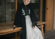 The Elegance of a Cape-Clad Cheongsam Woman