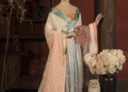 The Enchantment of a Peacock Cheongsam with a Blossom Pink Bloom