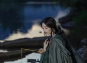 Embracing Modernity in a Traditional Bloom:The Rise of Black Cheongsam Women in Neo-Chinese Fashion